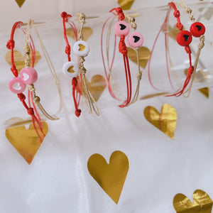 Beaded red string  heart bracelet