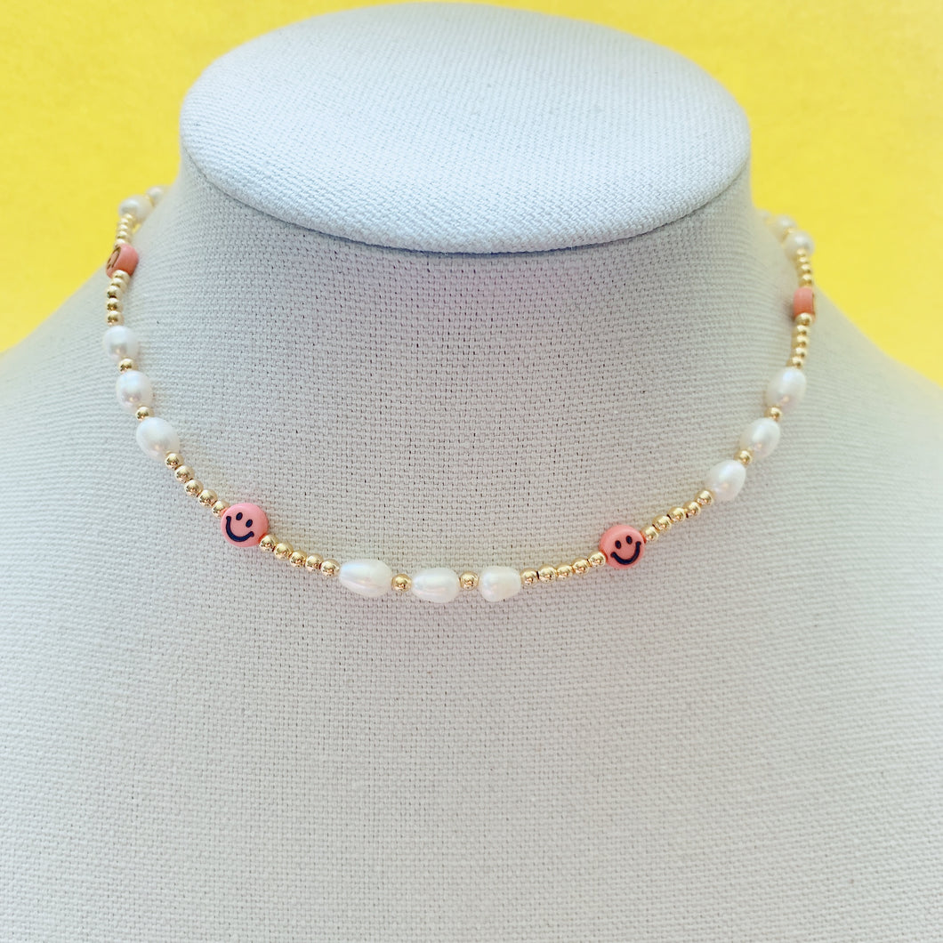 Smiley face pearl necklace