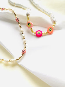 Smiley face pearl necklace