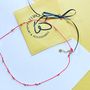 Red string  pearl necklace
