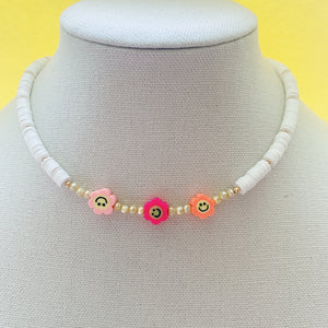 Smiley face pearl necklace